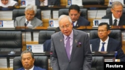 FILE - Malaysia's Prime Minister Najib Razak (R) delivers a speech.