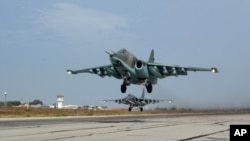 Russian Su-25 jets takes off for a mission from Hemeimeem Air Base, Syria, October 22, 2015.