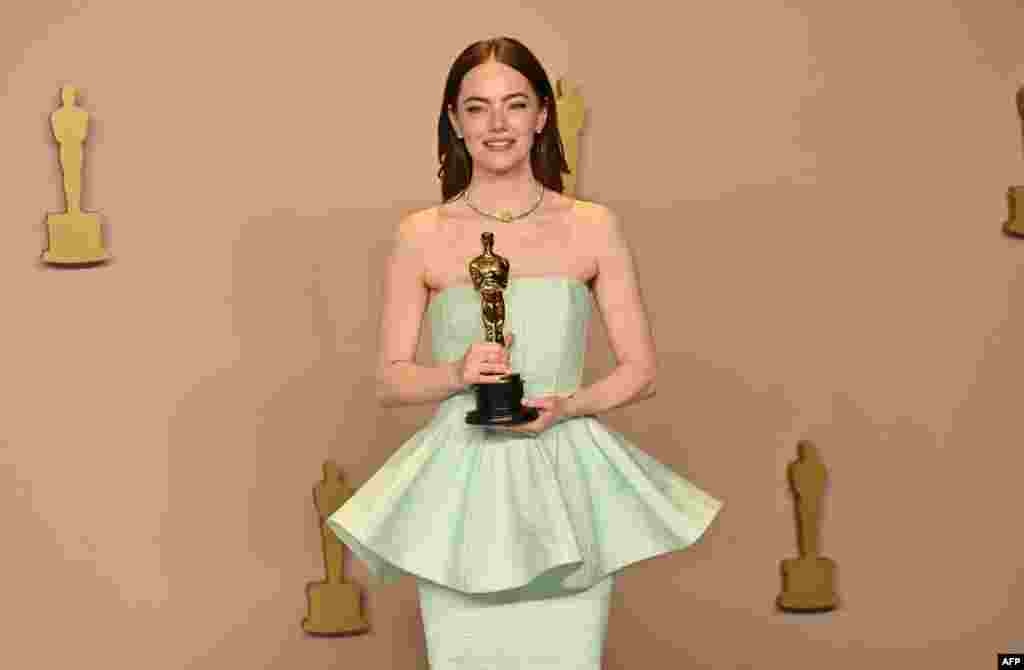 U.S. actress Emma Stone poses in the press room with the Oscar for Best Actress in a Leading Role for "Poor Things" during the 96th Annual Academy Awards at the Dolby Theatre in Hollywood, California, on March 10, 2024.