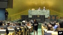 A U.N. conference officer distributes ballots to delegations as the UN General Assembly prepares to elect five new non-permanent members of the UN Security Council, Oct 18, 2012.