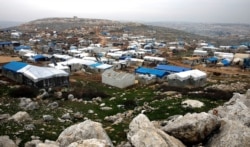 Makeshift shelters of internally displaced Syrians are seen from a hill top as part of an IDP camp located in Sarmada, Idlib province, Syria, Feb. 28, 2020. R
